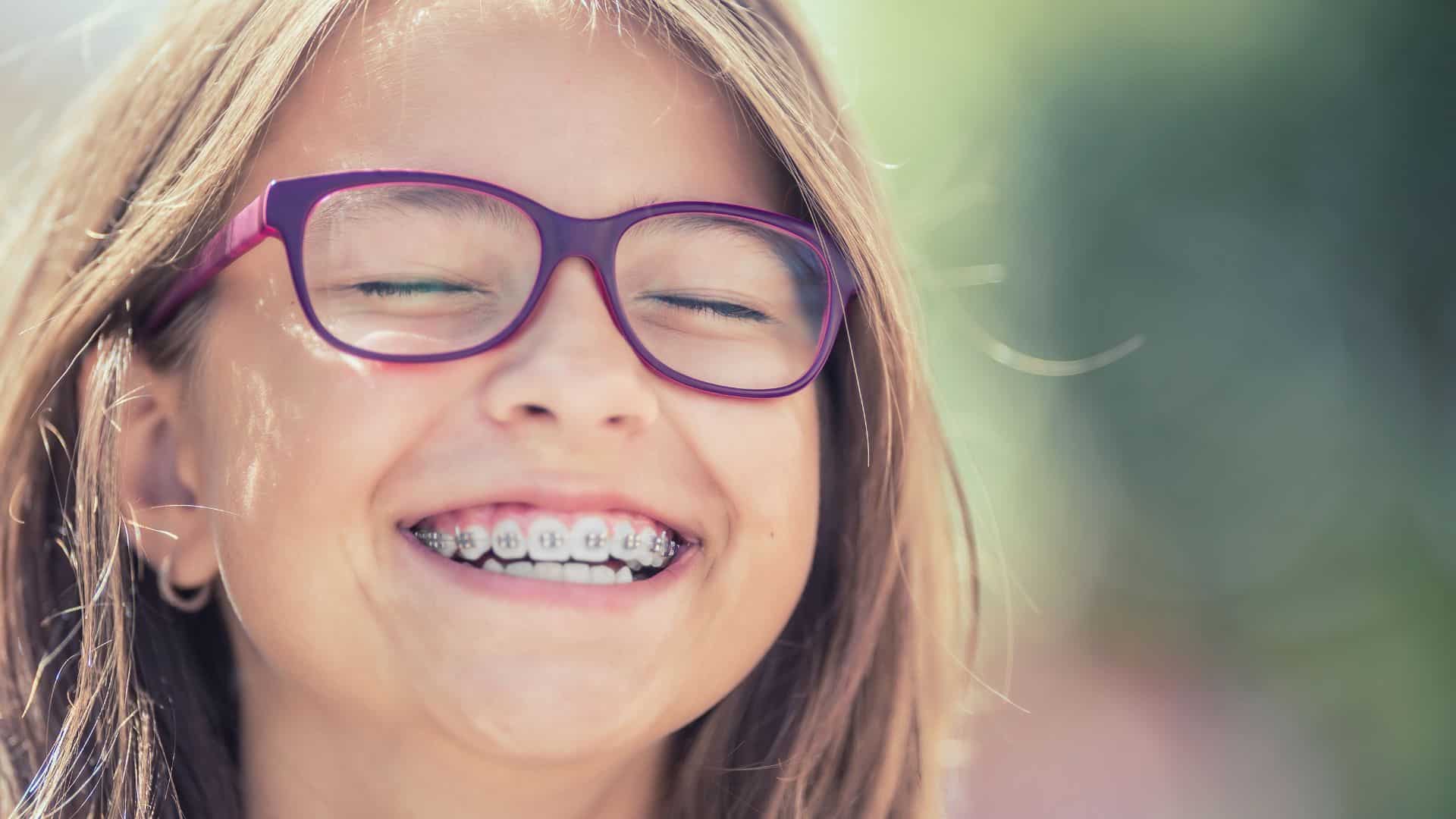 Smiling school girl with braces